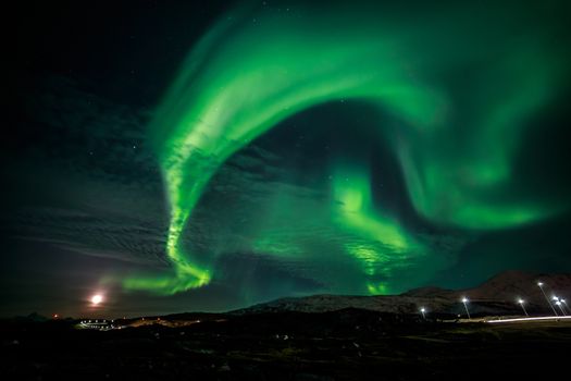 Green twisted northern lights, nearby Nuuk city, Greenland