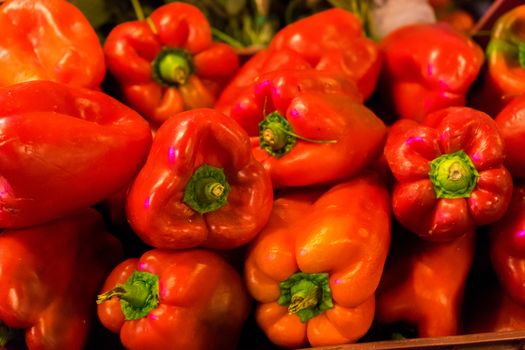 Many red peppers laying together