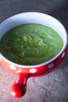 Green creamy vegetable soup with spinach and parsley