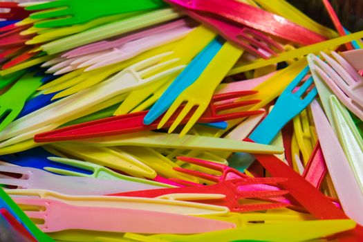 Bundle of colourful tiny forks used in picnics and parties.