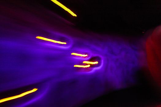 Abstract colors and light trails, purple and yellow