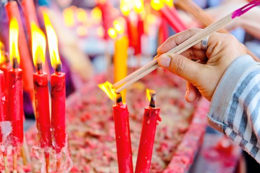 People light the candle at chinese temple