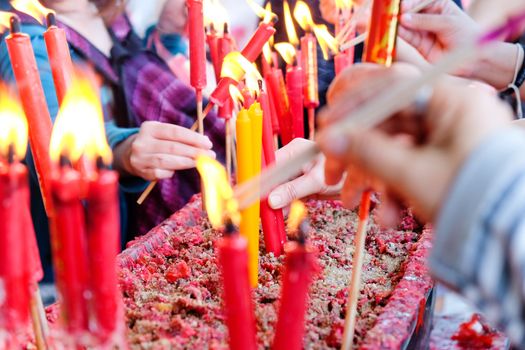 People light the candle at chinese temple
