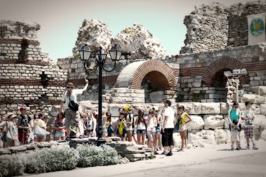 Nesebar, Bulgaria - August 29: People visit Old Town on August 29, 2014 in Nesebar, Bulgaria. Nesebar in 1956 was declared as museum city, archaeological and architectural reservation by UNESCO.