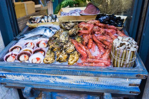 Fresh seafood displayed outside a restaurant in Barcelona, Spain in order to attract customers inside.