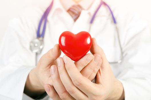 Cardiologist holding heart 3D model. heart medicine doctor healthcare stethoscope medical 3d model concept