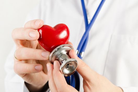 Cardiologist holding heart 3D model. heart medicine doctor healthcare stethoscope medical 3d model concept