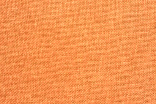 A pattern of a orange fabric filling the frame