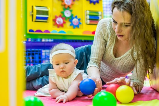 mother and child play in the children's room