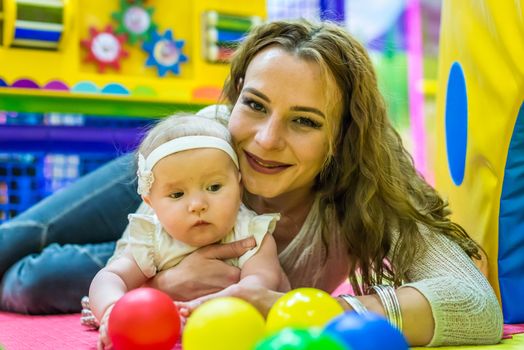 mother and child play in the children's room