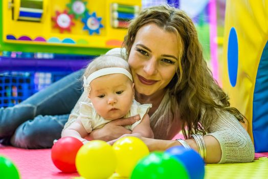 mother and child play in the children's room