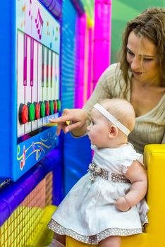 mother and child play in the children's room