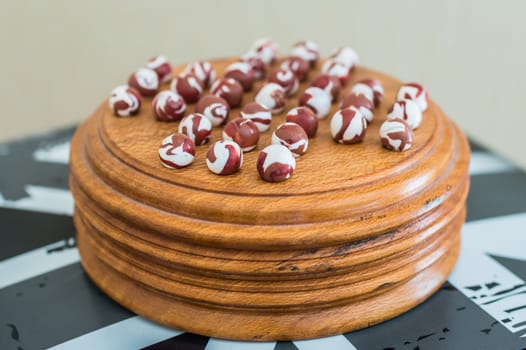 colored porcelain balls on a wooden stand