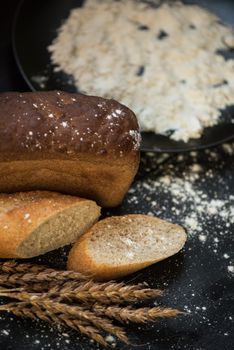 Bread composition with wheats. Very shallow DOF photo and specific art curly bokeh for extra volume.