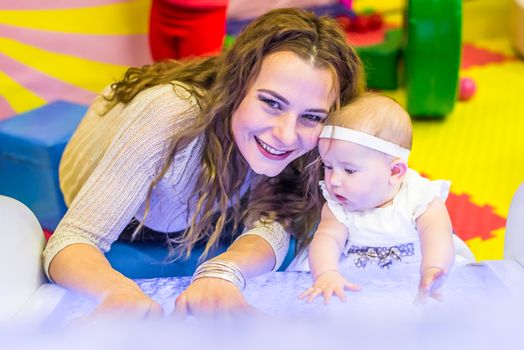 mother and child play in the children's room