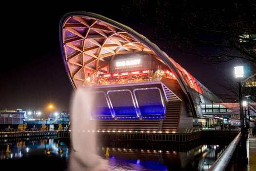 A picture of a building in canary warf, London during the winter lights show