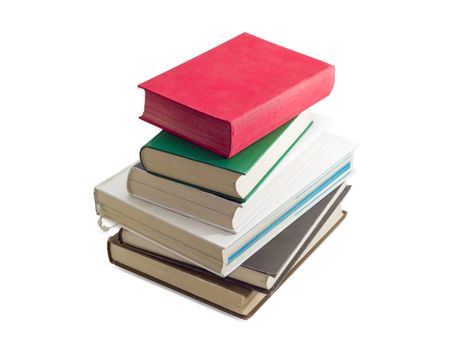 Stack of several books different formats and cover design on a light background
