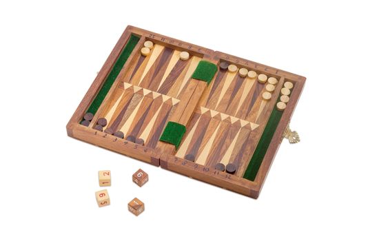 Miniature travelling wooden set to play backgammon on a light background
