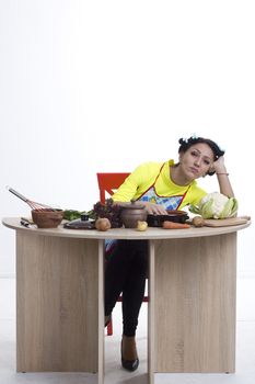 Housewife is preparing in the kitchen on a white background