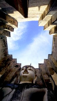 Historical Park Wat Sri chum temple bhudda statue up in Sukhothai world heritage