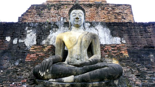 Historical Park Wat Mahathat temple bhudda statue in Sukhothai world heritage horizontal