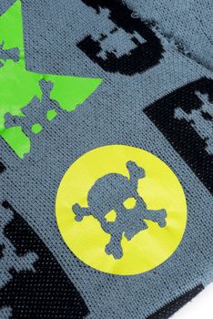 Fabric with skulls and bones .