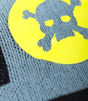 Fabric with skulls and bones .
