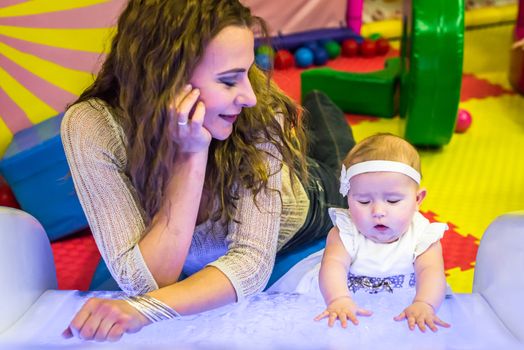 mother and child play in the children's room