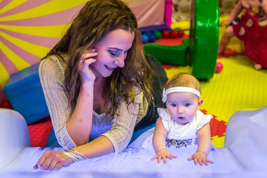 mother and child play in the children's room