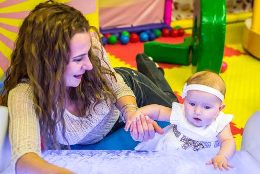 mother and child play in the children's room