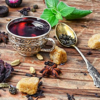 Cup of tea,dry tea leaves of different varieties and spices