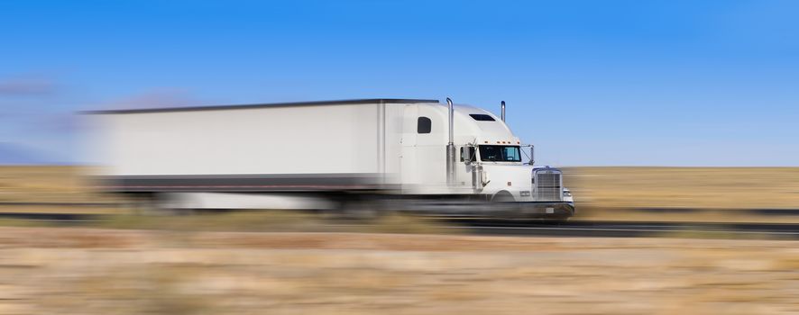 white truck on the move in the desert