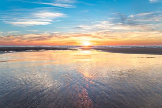 Beautiful sunset at the beach during a winter evening.