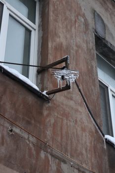 Antenna covered by ice after the winter thaw