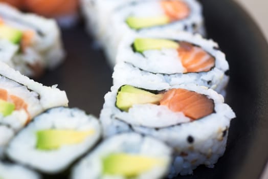 Set of sushi with salmon and avocado, sushi menu macro photo