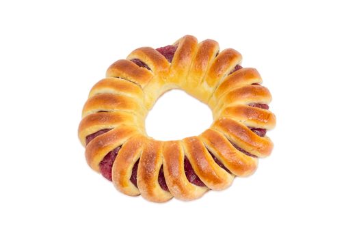 Pie with jam in the form of a ring, shaped like a bagel on a light background
