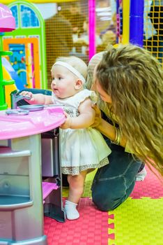 mother and child play in the children's room