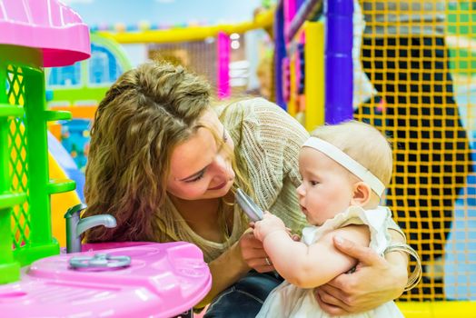 mother and child play in the children's room