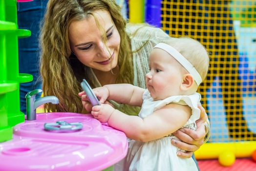 mother and child play in the children's room