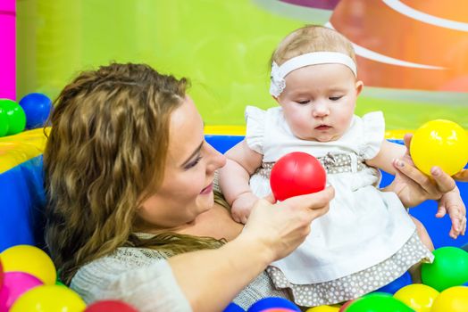 mother and child play in the children's room