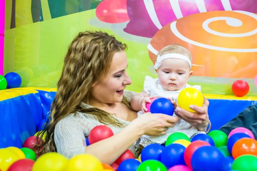 mother and child play in the children's room