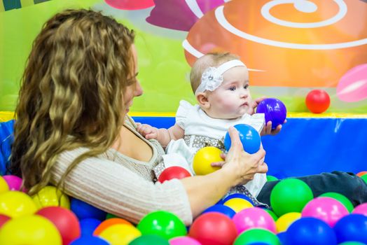 mother and child play in the children's room