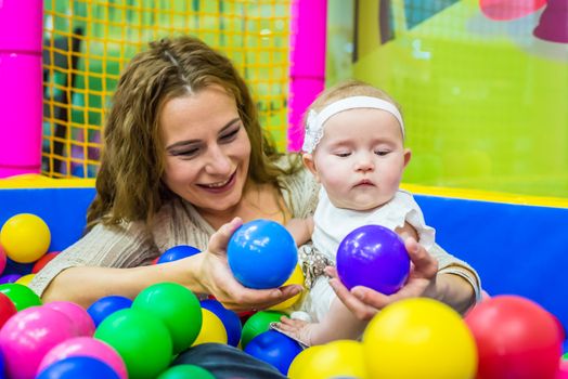 mother and child play in the children's room