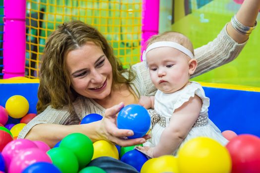 mother and child play in the children's room