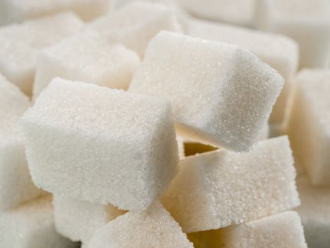 Background of sugar cubes. White cube sugar close up as food background
