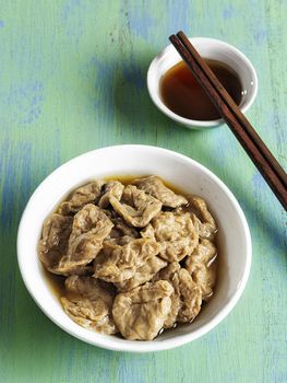 close up of a bowl of seitan vegetarian mock abalone