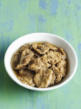 close up of a bowl of seitan vegetarian mock abalone