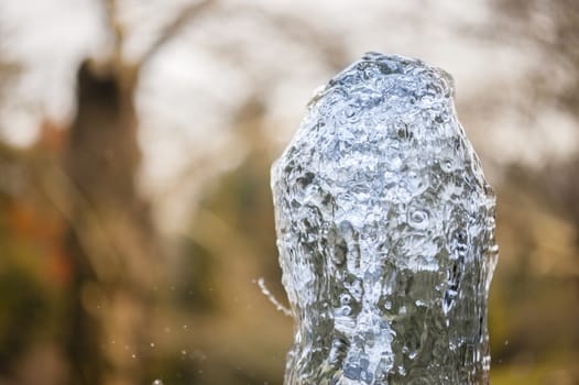 Close up of ornamental fountain water gush.