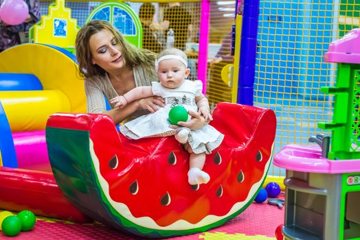 mother and child play in the children's room