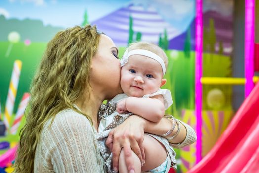 mother and child play in the children's room